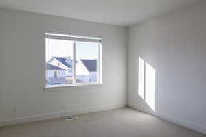 View of carpeted spare room