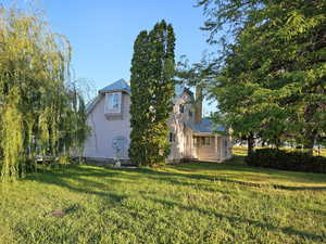 Exterior space featuring a yard