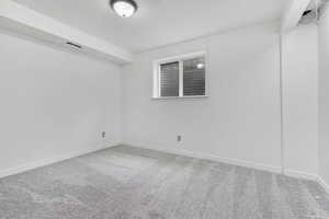 Empty room featuring carpet