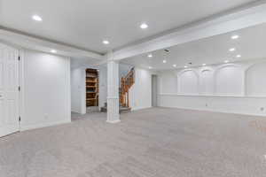 Basement with light colored carpet