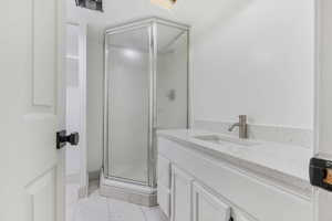 Bathroom with vanity and walk in shower