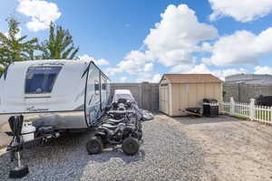 Extra Deep RV parking and storage shed.