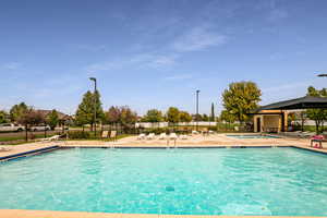 View of swimming pool with a patio and a gazebo