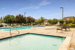 View of swimming pool featuring a patio