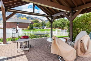 View of patio with a gazebo and a mountain view