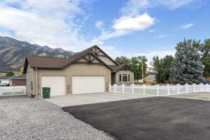 View of front facade featuring a mountain view and a garage