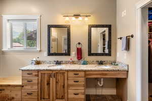 Bathroom featuring vanity and hardwood / wood-style floors