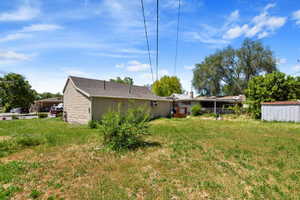 View of yard with a storage unit