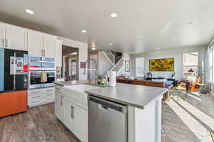 Kitchen featuring a center island with sink