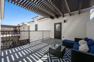 View of patio / terrace featuring outdoor lounge area and a pergola