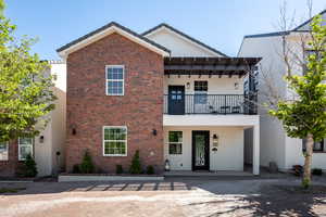 View of front of property featuring a balcony