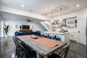 Dining space featuring sink and ceiling fan