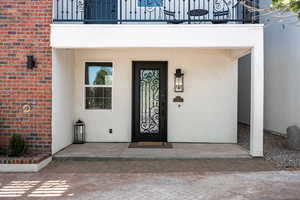 Entrance to property featuring a balcony