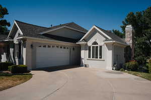 Ranch-style house featuring a garage