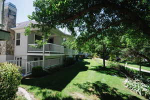 View of yard featuring a balcony