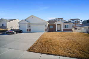 View of front of home featuring extra deep 3rd car garage and RV parking