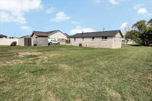 View of the yard with a storage unit