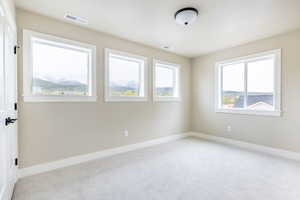 Empty room with carpet floors