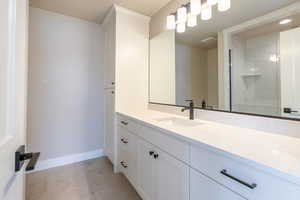 Bathroom with vanity and walk in shower