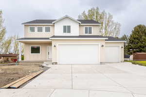 View of front of property featuring a garage