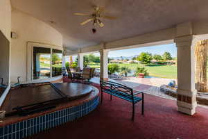 View of patio with ceiling fan