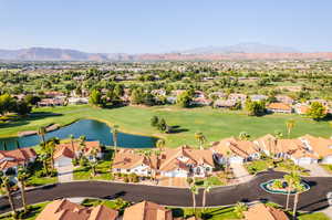 Birds eye view of property featuring a water and mountain view