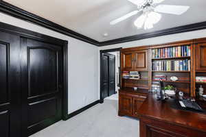 Office area featuring crown molding, light colored carpet, and ceiling fan