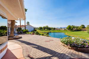 View of patio / terrace with a water view