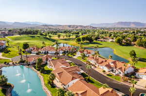 Drone / aerial view with a water and mountain view