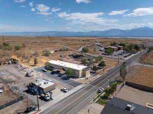 Birds eye view of property with a mountain view