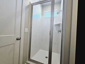 Bathroom featuring a shower with shower door