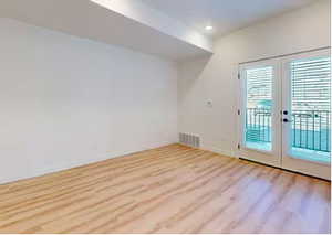 Doorway featuring french doors and hardwood / wood-style flooring