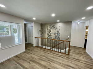 Hallway featuring wood-type flooring