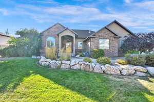 View of front of property with a front lawn