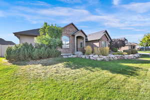 View of front of property with a front lawn