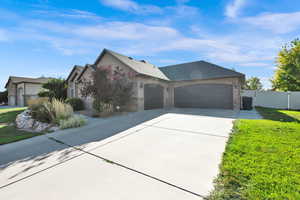 View of front of house with a front lawn and a garage