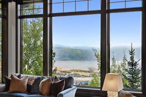 Interior space with a water and mountain view