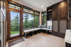 Interior space with plenty of natural light and light tile patterned floors