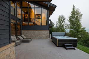 View of patio / terrace with a hot tub