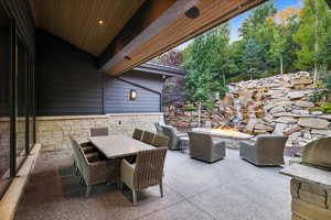 View of patio with a fire pit