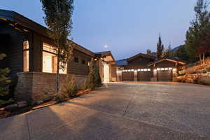 Property exterior at dusk featuring a garage