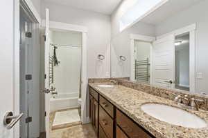 Full bathroom with vanity, toilet, and washtub / shower combination