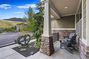 View of patio featuring a mountain view and covered porch