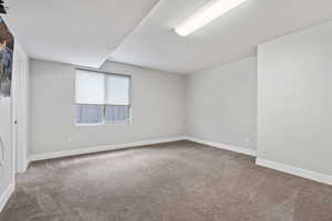 Unfurnished room with carpet flooring