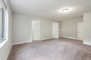 Empty room with carpet floors