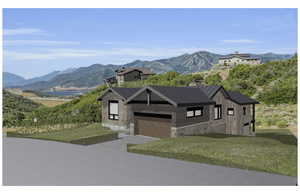 View of front facade with a mountain view and a front yard