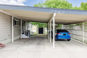 View of vehicle parking with a carport