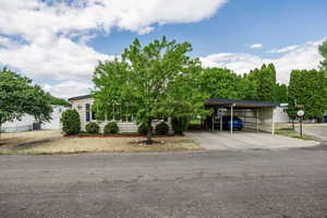 View of front of house with central air condition unit