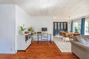 Office area featuring hardwood / wood-style flooring and an inviting chandelier