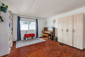 Bedroom featuring dark hardwood / wood-style floors